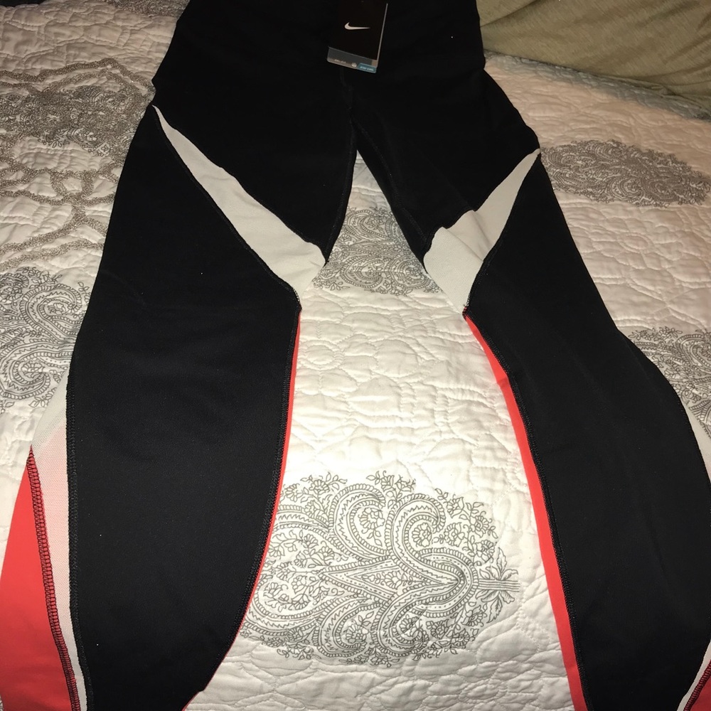 NWT Nike Legendary Tights. Small Red-Orange, black